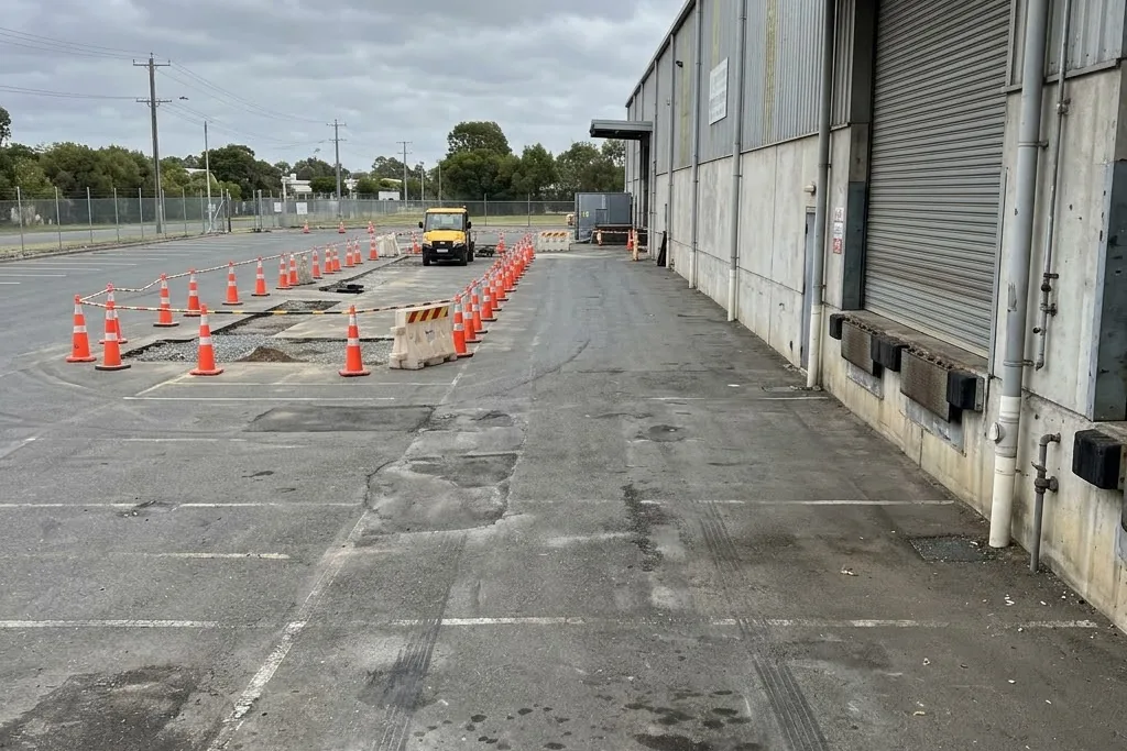 A plaza loading bay kept reachable while the lot around it is worked on