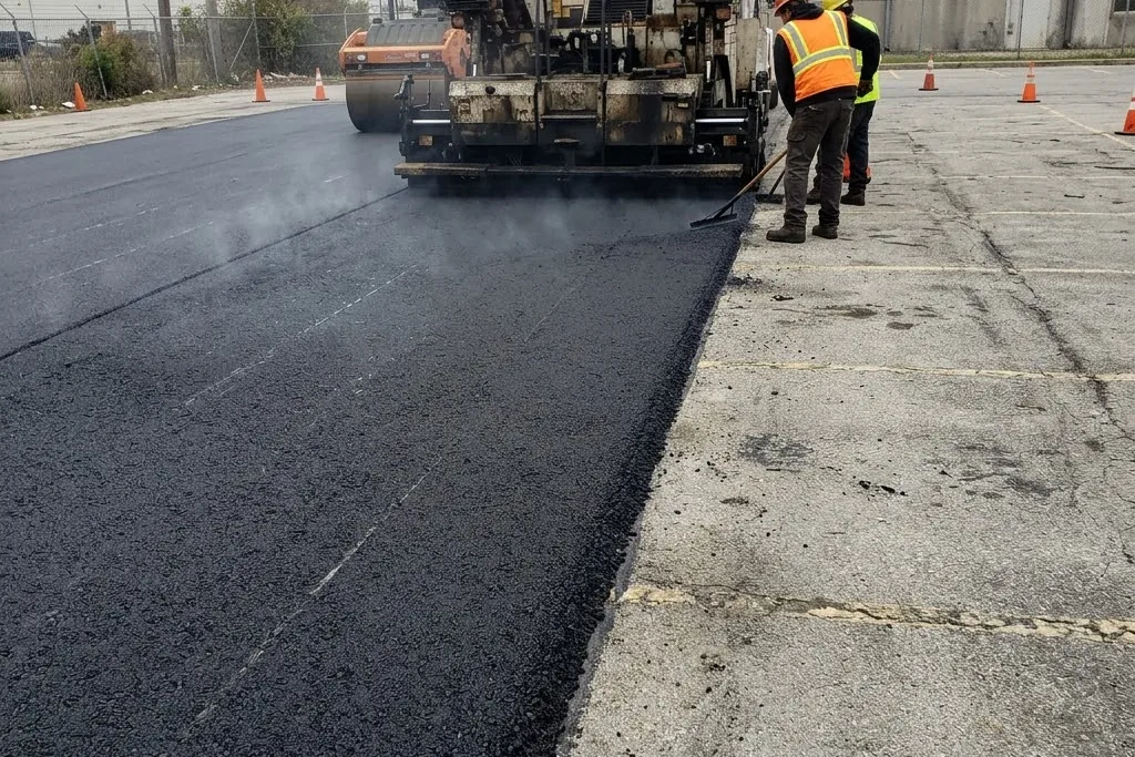 A bonded asphalt overlay laid across an existing sound surface